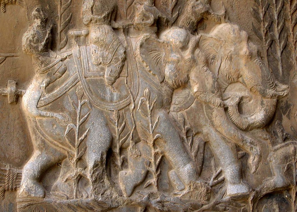 1024px-Elephants_relief_Taq-e_Bustan_V.jpg