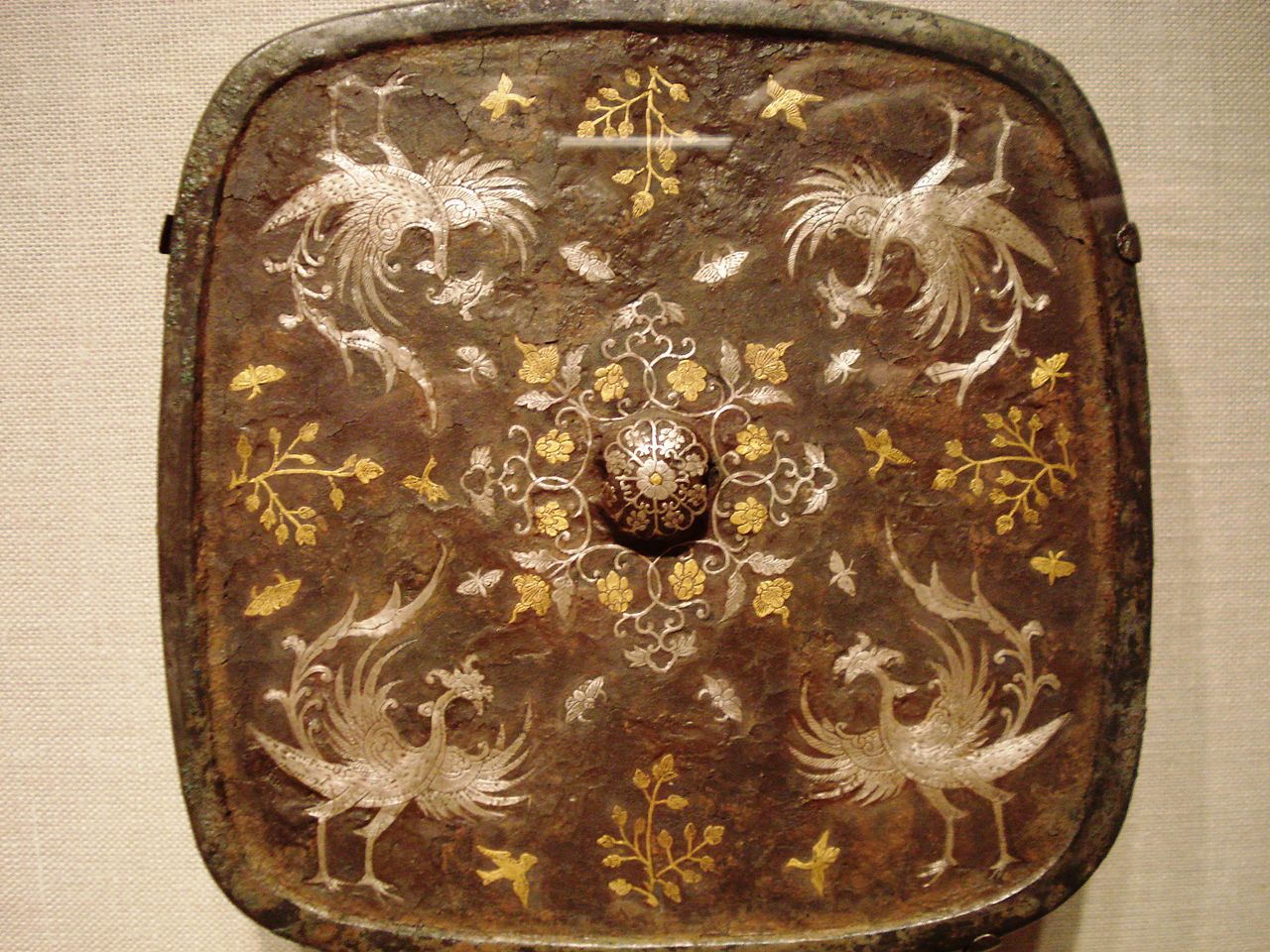 1280px-Square_mirror_with_phoenix_motif,_Tang_Dynasty.jpg