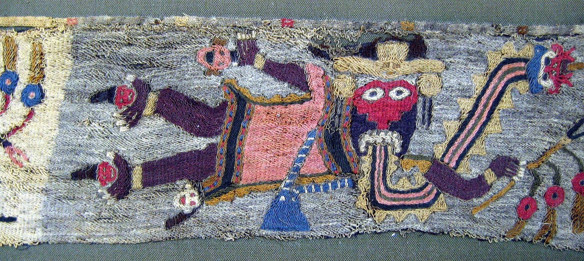 1920px-Embroidered_Fragment_with_Figures_MET_33.43d.jpg