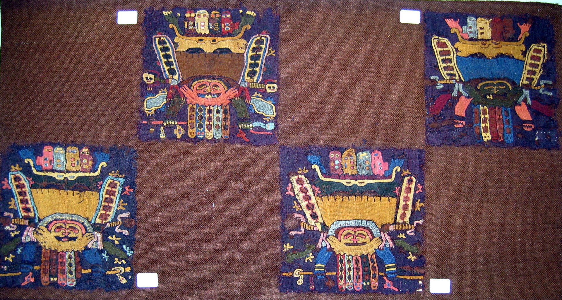 1920px-Embroidered_Mantle_Fragment_MET_33.149.64-73-89-91.jpg