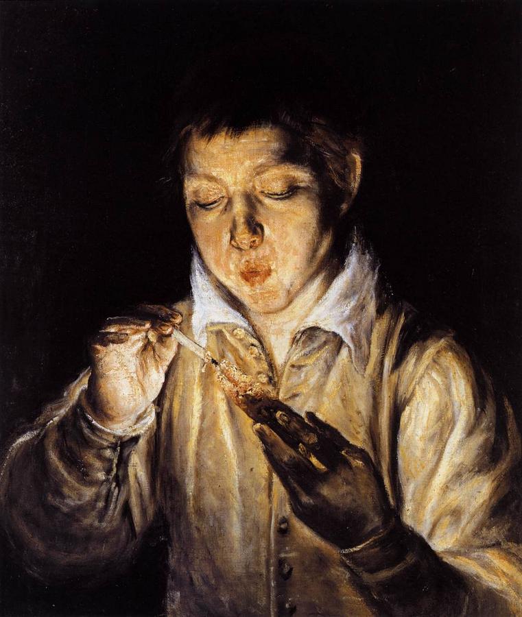 a-boy-blowing-on-an-ember-to-light-a-candle.jpg