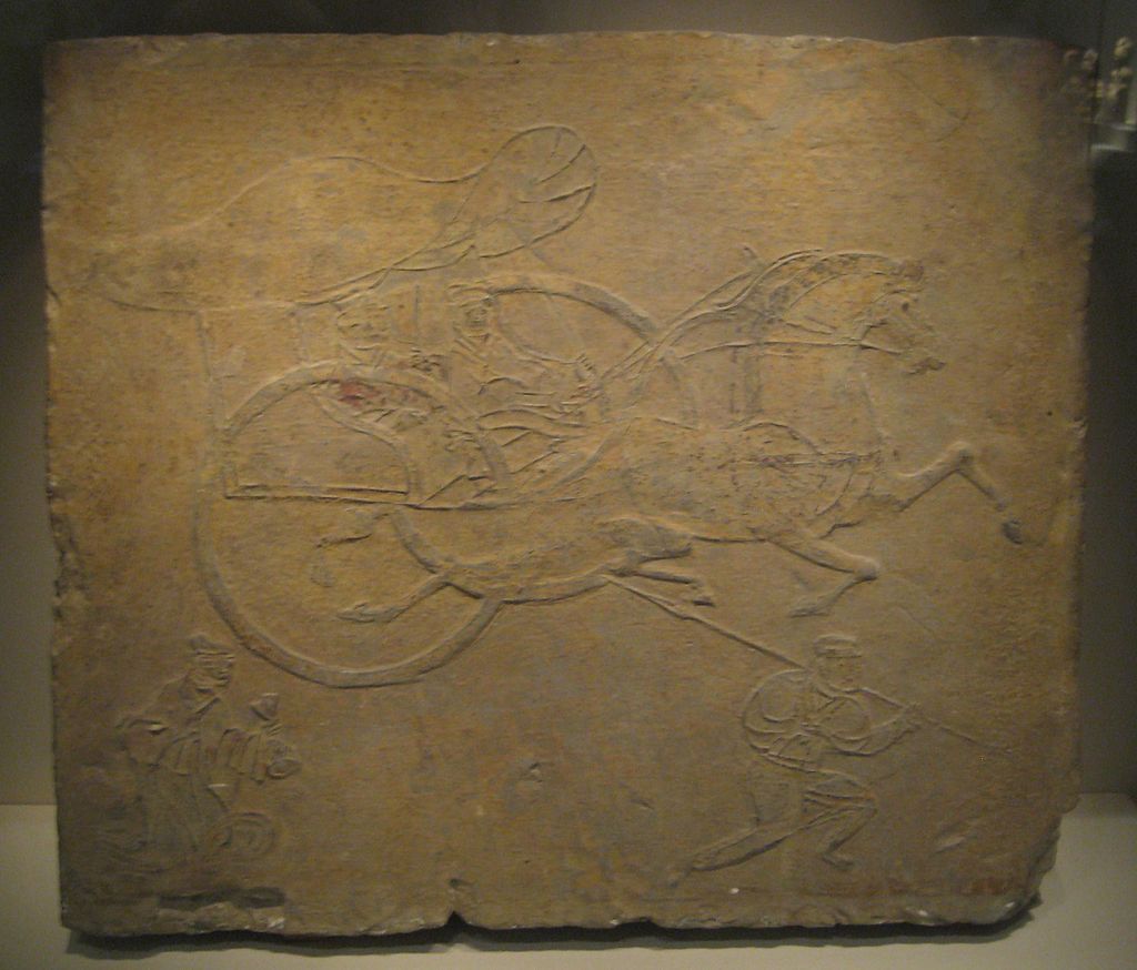 Brick_relief_depicting_a_horse-drawn_carriage.jpg