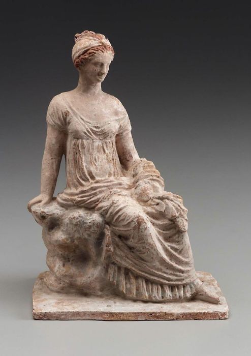 terracotta-woman-seated-on-a-rock-made-in-tanagra-greece-3rd-century-bc-1347431355_b.jpg